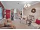 Cozy living room with natural light, featuring a decorative chandelier and staircase at 409 Ridge Rd, Clover, SC 29710