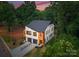Stunning new construction features modern design with white and wood accents, plus attached two car garage at 4117 Sarah Dr, Charlotte, NC 28217