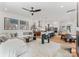 Open-concept living room with modern kitchen, dining area, and stylish furniture on light-colored hardwood floors at 4117 Sarah Dr, Charlotte, NC 28217