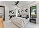 Stylish main bedroom with chic decor, modern lighting, and black framed windows at 4117 Sarah Dr, Charlotte, NC 28217