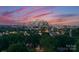 Picturesque skyline view at sunset overlooking treetops of the city's beautiful buildings at 4117 Sarah Dr, Charlotte, NC 28217