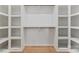Spacious walk-in closet with custom shelving and hardwood floors for organized storage at 4117 Sarah Dr, Charlotte, NC 28217