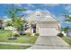 Charming single-Gathering home featuring stone accents, manicured lawn, and a two-car garage at 4333 Legacy Dr, Denver, NC 28037