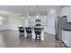 Bright, open kitchen with a large island, stainless steel appliances, and white cabinetry at 4333 Legacy Dr, Denver, NC 28037