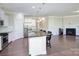 Stylish open-concept kitchen and living area with hardwood floors and modern finishes at 4333 Legacy Dr, Denver, NC 28037