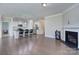 Bright, airy open-concept space with a kitchen island, and a living area with fireplace at 4333 Legacy Dr, Denver, NC 28037