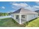 A covered patio with sliding doors leads to the home's landscaped backyard and lawn at 4333 Legacy Dr, Denver, NC 28037