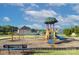 Community playground with swings, a slide, and climbing structures for active play in a Gathering-friendly setting at 4333 Legacy Dr, Denver, NC 28037