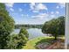 Scenic lake view with lush trees, blue skies, and partially constructed fire pit area near the water at 4455 Reed Creek Dr # 101, Sherrills Ford, NC 28673