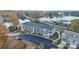 Aerial view showcasing townhomes near a picturesque lake; boat storage is visible at 4455 Reed Creek Dr # 202, Sherrills Ford, NC 28673