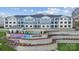 Modern apartment complex with terraced landscaping, pool, and stylish blue and white facade; perfect for upscale living at 4455 Reed Creek Dr # 203, Sherrills Ford, NC 28673