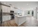 Modern kitchen with white cabinets, stainless steel appliances, a kitchen island, and hardwood floors at 4455 Reed Creek Dr # 203, Sherrills Ford, NC 28673