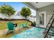 Relaxing back patio view with string lights, Adirondack chairs, and a stylish outdoor rug on a concrete patio at 5059 Fenwick Ct, Lancaster, SC 29720