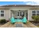 Covered back patio featuring hanging egg chairs and Adirondack chairs at 5059 Fenwick Ct, Lancaster, SC 29720
