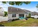 Backyard featuring a covered patio and manicured lawn at 5059 Fenwick Ct, Lancaster, SC 29720