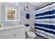 Bathroom featuring a single vanity, toilet, and shower with a blue striped curtain at 5059 Fenwick Ct, Lancaster, SC 29720