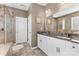 Bathroom featuring a granite double vanity and a tiled glass-enclosed shower at 5059 Fenwick Ct, Lancaster, SC 29720