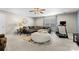 Bonus room featuring a large sectional sofa and exercise equipment at 5059 Fenwick Ct, Lancaster, SC 29720