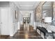 Inviting entryway features wood flooring, decorative wallpaper and molding, plus views into the living area at 5059 Fenwick Ct, Lancaster, SC 29720