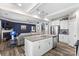 Open kitchen flows into a living room with fireplace and offers a center island and stainless steel appliances at 5059 Fenwick Ct, Lancaster, SC 29720