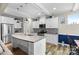 Bright kitchen features white cabinetry, stainless steel appliances, a large island, and stylish pendant lighting at 5059 Fenwick Ct, Lancaster, SC 29720