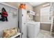 Laundry room featuring built-in storage cabinets, washer, and dryer at 5059 Fenwick Ct, Lancaster, SC 29720