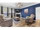 Comfortable living room with hardwood floors, fireplace, and relaxing, upholstered furniture at 5059 Fenwick Ct, Lancaster, SC 29720