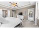 The main bedroom includes a tray ceiling, access to the backyard, and an attached bath with a glass shower at 5059 Fenwick Ct, Lancaster, SC 29720