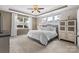 A spacious main bedroom with a tray ceiling, large windows, and a walk-in closet offers a comfortable retreat at 5059 Fenwick Ct, Lancaster, SC 29720