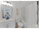 Bright bathroom features a vanity with modern fixtures and a shower/tub combination at 5229 Tarrywood Ln, Charlotte, NC 28205