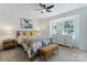 Comfortable bedroom featuring natural light and neutral color palette at 5229 Tarrywood Ln, Charlotte, NC 28205