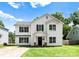 Charming two-story home features a classic white exterior and well-manicured lawn at 5229 Tarrywood Ln, Charlotte, NC 28205