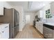 Modern kitchen featuring stainless steel appliances and ample white cabinetry at 5229 Tarrywood Ln, Charlotte, NC 28205