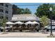 A quaint storefront, offering a comfortable outdoor dining setting and ample space for patrons at 5229 Tarrywood Ln, Charlotte, NC 28205