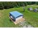Aerial view of the property with a metal garage and a couple of storage buildings at 5354 Sherrills Ford Rd, Catawba, NC 28609