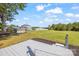 Wide backyard view from the porch, with a large green lawn extending to a house and shed at 5354 Sherrills Ford Rd, Catawba, NC 28609