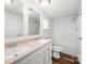 Bathroom with double sinks, white cabinetry, and a shower-tub combo at 5354 Sherrills Ford Rd, Catawba, NC 28609