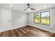 Bedroom with a ceiling fan and large window with a view of the yard at 5354 Sherrills Ford Rd, Catawba, NC 28609