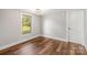 Cozy bedroom featuring a window with natural light and wood flooring at 5354 Sherrills Ford Rd, Catawba, NC 28609