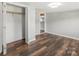 Bedroom with a spacious closet and wood-look flooring, providing a cozy retreat in the home at 5354 Sherrills Ford Rd, Catawba, NC 28609