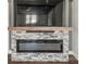 The living room has a modern stone and metal fireplace at 5354 Sherrills Ford Rd, Catawba, NC 28609