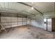 Spacious garage interior with concrete floor, great for storage or projects, featuring a refrigerator at 5354 Sherrills Ford Rd, Catawba, NC 28609