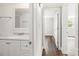 Hallway leading to bathroom and bedroom with hardwood floors at 5354 Sherrills Ford Rd, Catawba, NC 28609