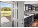 A partial view of the kitchen with stainless steel appliances and granite countertops from the door at 5354 Sherrills Ford Rd, Catawba, NC 28609