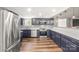 The kitchen features stainless steel appliances, granite countertops and custom wood flooring at 5354 Sherrills Ford Rd, Catawba, NC 28609