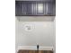 Laundry room features sleek cabinets, modern hookups, and stylish wood-look flooring at 5354 Sherrills Ford Rd, Catawba, NC 28609