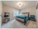 Cozy bedroom featuring a queen-size bed, soft carpet, and a relaxing atmosphere at 5707 Fairvista Dr, Charlotte, NC 28269