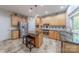 Modern kitchen with stainless steel appliances, center island with bar stools, and wooden cabinets that offer ample storage at 5707 Fairvista Dr, Charlotte, NC 28269