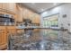 Gourmet kitchen boasts granite countertops, stainless steel appliances, and ample cabinet space for all your cooking needs at 5707 Fairvista Dr, Charlotte, NC 28269