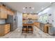 Well-appointed kitchen features stainless steel appliances, granite countertops, and a central island with seating at 5707 Fairvista Dr, Charlotte, NC 28269